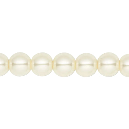A close-up of a strand of creamy white freshwater pearls aligned horizontally against a solid white background.