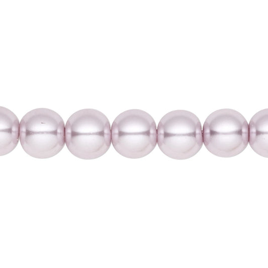 A close-up of a strand of light pink lustrous pearls on a plain white background.