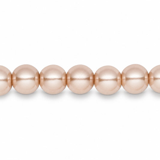 A close-up of a strand of round, lustrous pearls in a soft champagne pink color, shown against a plain white background.