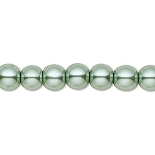 A close-up of a strand of glossy, metallic sage green beads on a plain white background.