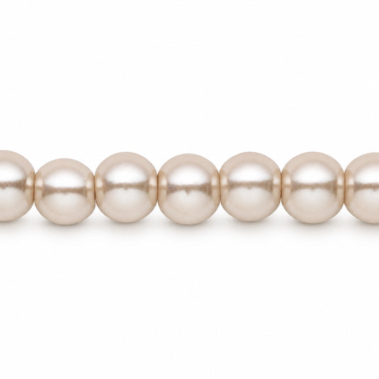 A close-up of a strand of round, lustrous pearl-like beads in a warm off-white or cream tone, shown against a plain white background.