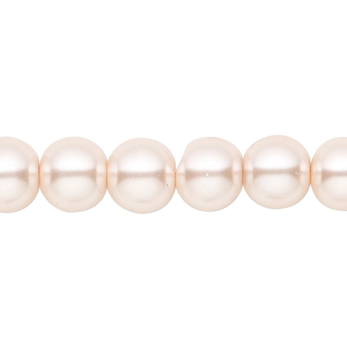 A close-up of a strand of round, lustrous pearl beads in a soft champagne-pink color, shown against a plain white background.