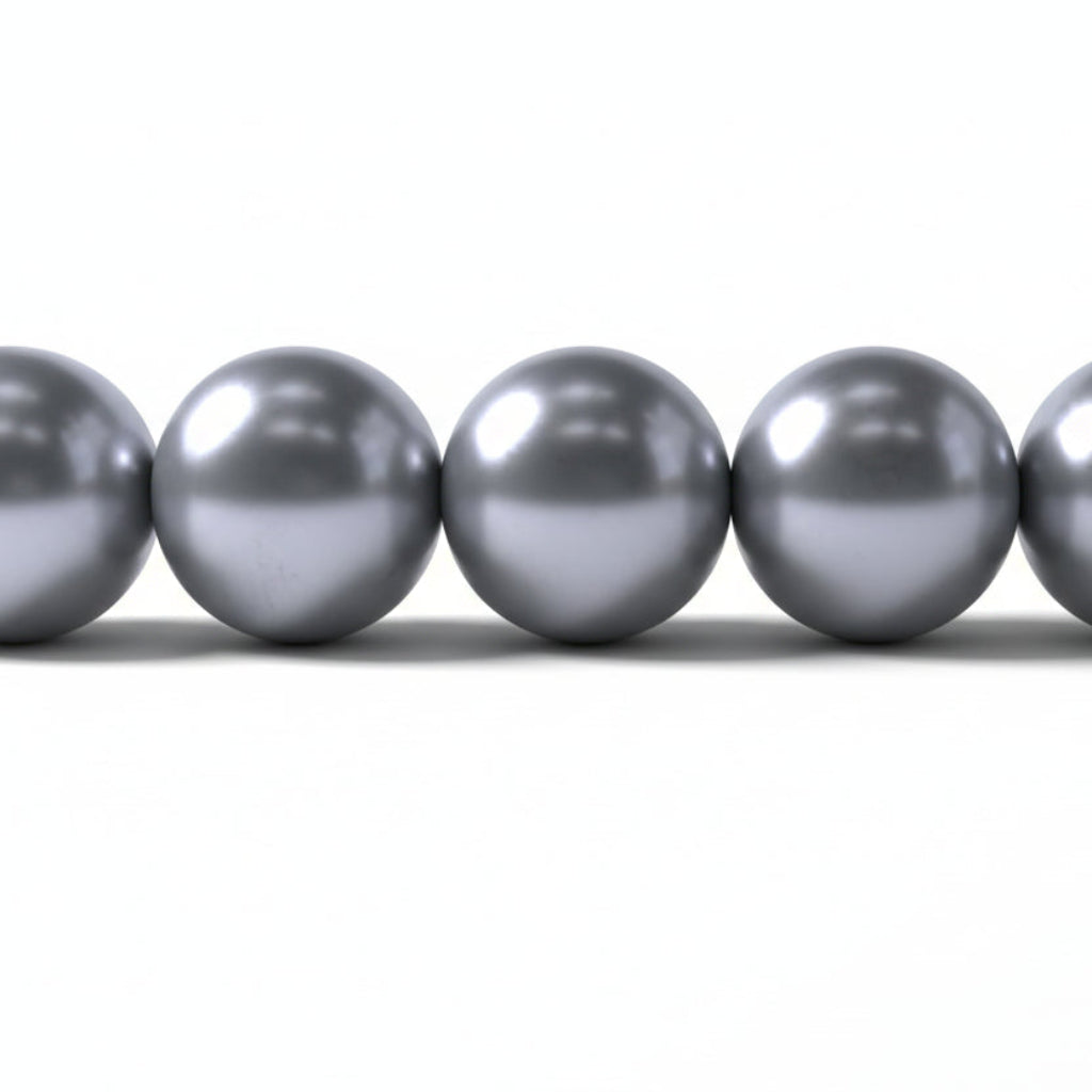A close-up of five metallic silver beads aligned horizontally on a plain white background.