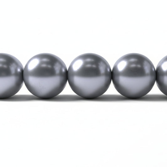 A close-up of five metallic silver beads aligned horizontally on a plain white background.