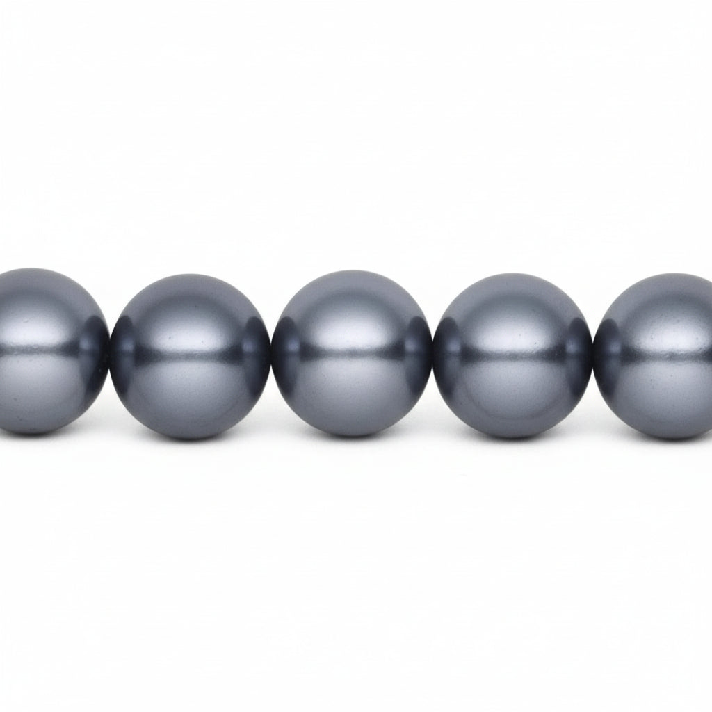 A close-up of five dark gray pearl-like beads aligned horizontally on a plain white background.