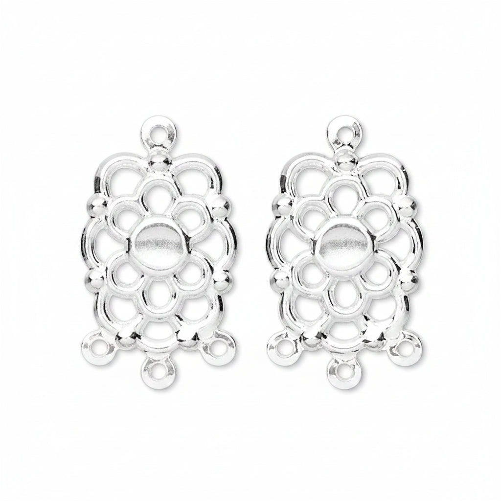 Two silver-toned metal filigree charms with a floral or medallion-like openwork design and top loop, shown on a plain white background.