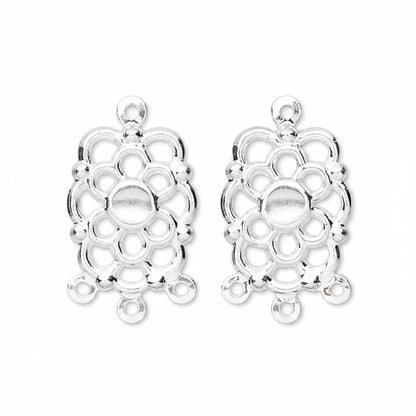 Two silver-toned metal filigree charms with a floral or medallion-like openwork design and top loop, shown on a plain white background.