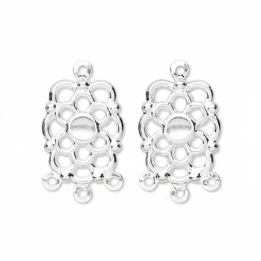 Two silver-toned metal filigree charms with a floral or medallion-like openwork design and top loop, shown on a plain white background.