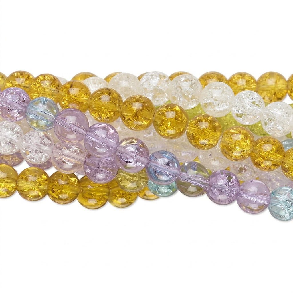 Close-up of round translucent gemstone beads in multiple strands, including yellow, clear, and lavender-purple tones, on a white background.
