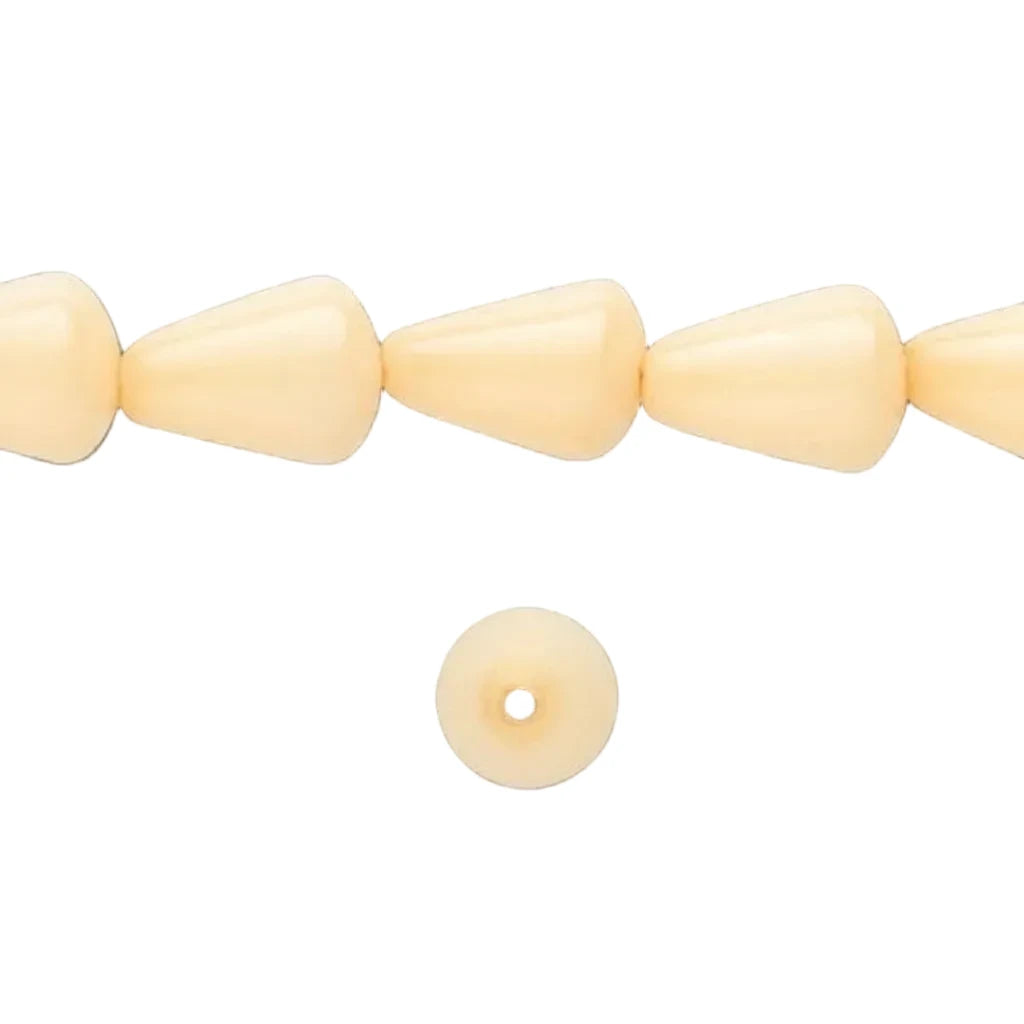 A strand of pale cream cone-shaped beads and a single matching round disc bead with a center hole, shown on a solid dark gray background.