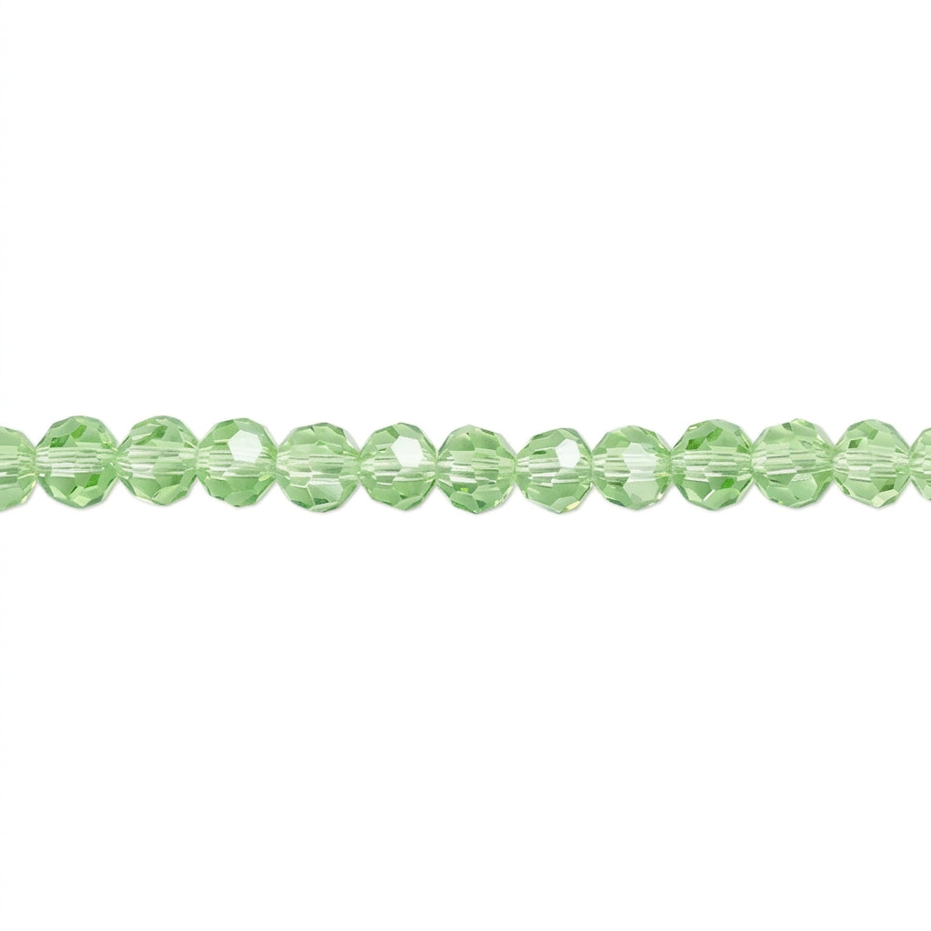 A strand of light green faceted round beads aligned horizontally on a plain white background.