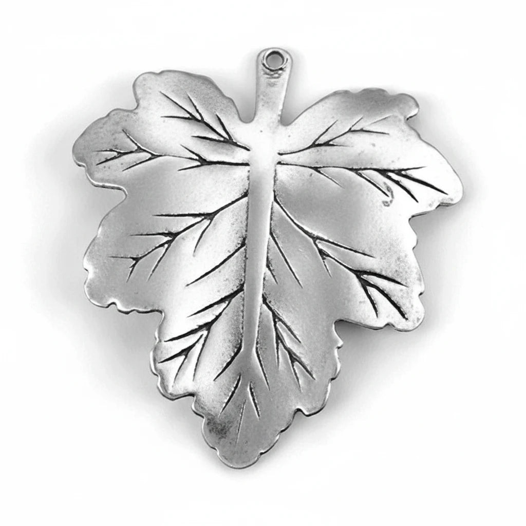 A single metallic leaf-shaped pendant or charm with a small loop at the top, shown on a plain white background.