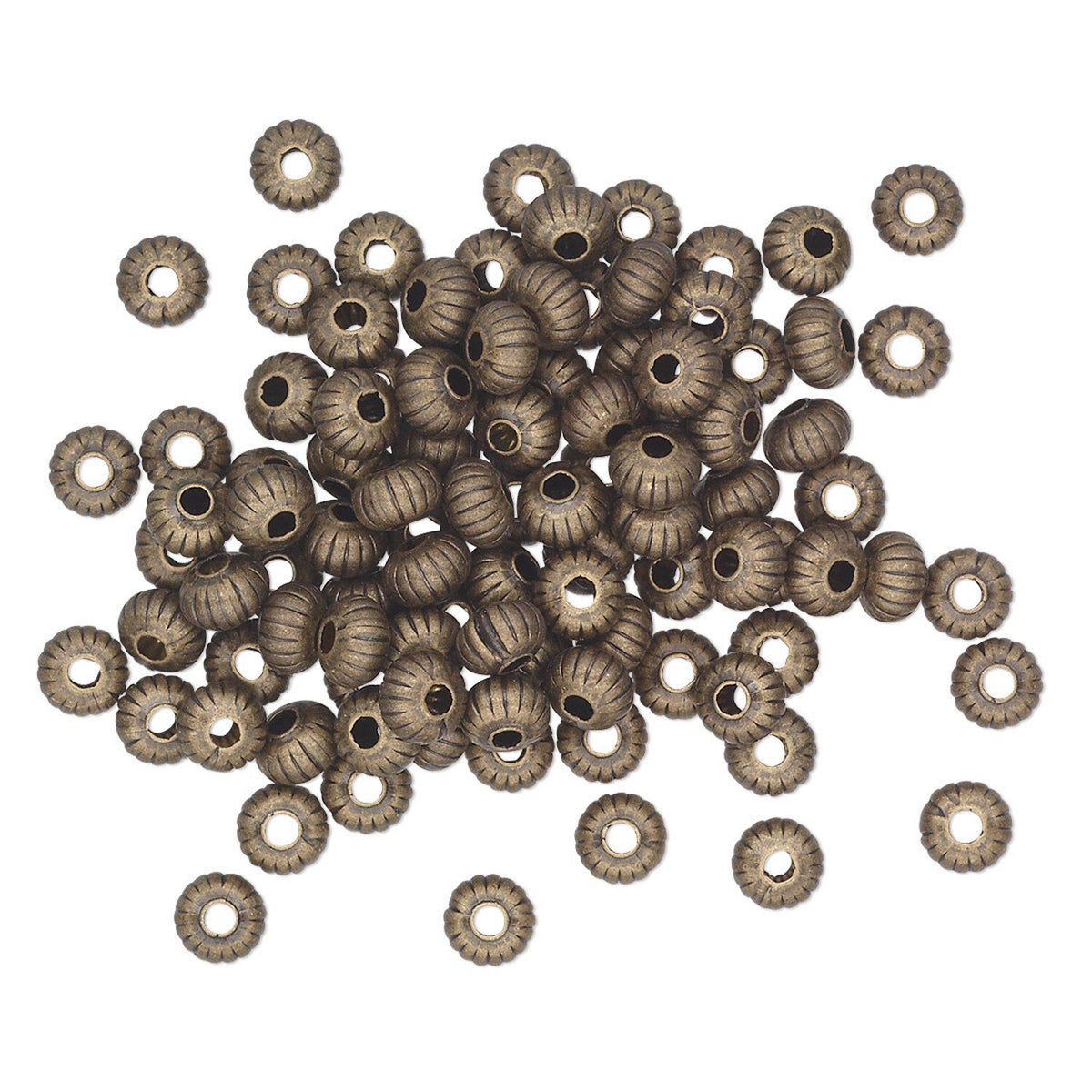 A pile of metallic bronze-colored seed beads with a ribbed, textured surface and hollow centers, arranged on a plain white background.
