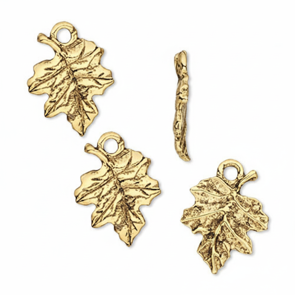 Four gold-toned leaf-shaped charms with textured details, including two larger oak leaves, one smaller oak leaf, and one twig-shaped charm, displayed on a clean white background.