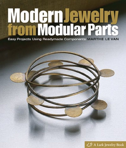 Book cover for 'Modern Jewelry from Modular Parts' by Marthe Le Van, featuring a metallic modular ring structure on a light gray background with a dark textured top section.