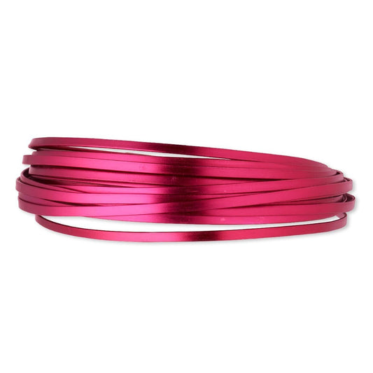 Magenta metal wire coil on a white background