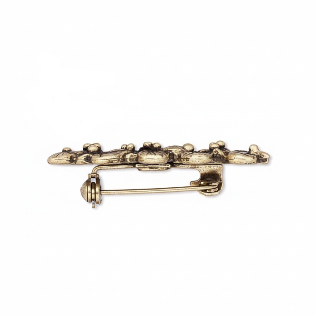 antique gold holly leaf and berry brooch pin on a plain white background, showing the front decorative side, the back with pin clasp, and the reverse side.