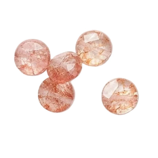 Four round faceted gemstone beads in a peachy pink color with natural crystalline texture, displayed on a clean white background.