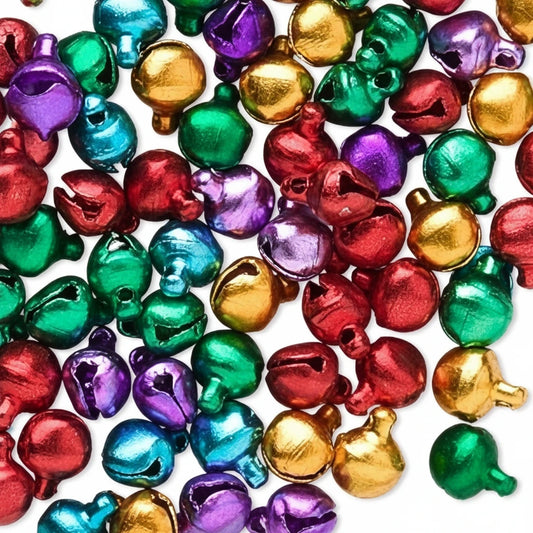 A pile of small metallic jingle bells in assorted colors including red, green, purple, blue, and gold on a white background.