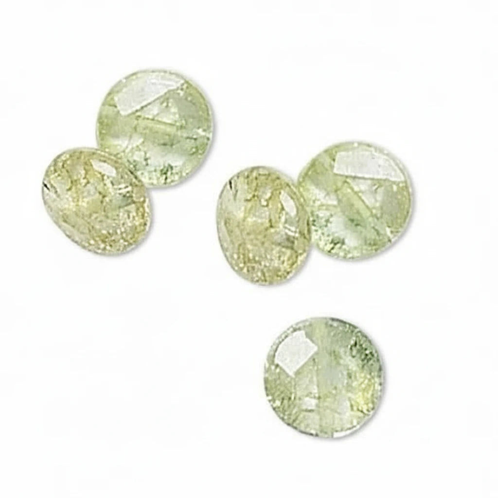 Five faceted round gemstones in a pale yellow-green hue, arranged on a plain white background.