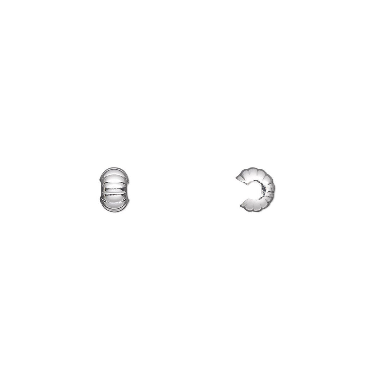 Silver jewelry components on a white background