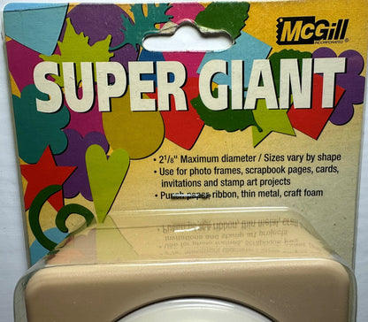 McGill Super Giant die-cut craft foam sheet in its original retail packaging, featuring a colorful background with green, yellow, purple, and red shapes, and a beige foam sheet visible at the bottom.