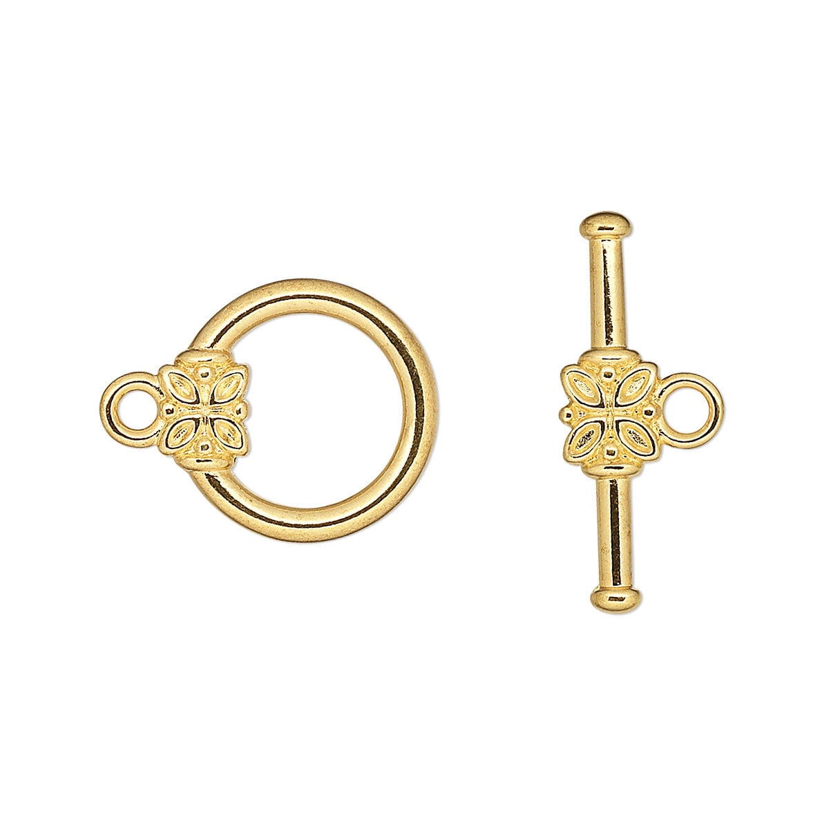 Gold ring and key-shaped object on a white background