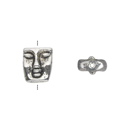 An antique silver-toned metal bead featuring a stylized face design, shown from two angles (front and side profile) on a plain white background.