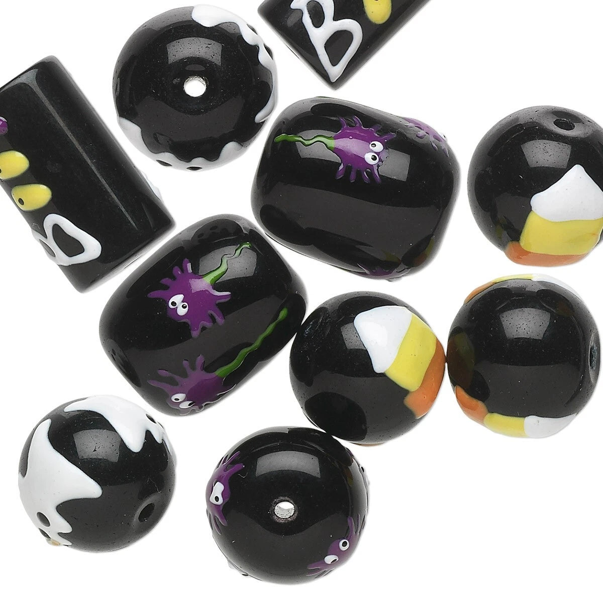 A collection of glossy black glass craft beads with various Halloween-themed designs, including purple spiders, white ghosts, yellow and orange candy corn, and black and white splatter patterns, arranged on a plain white background.