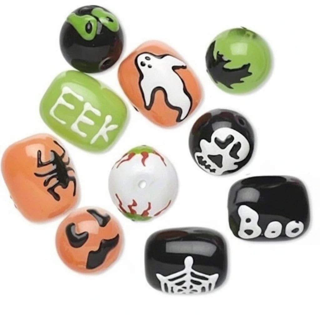 A set of Halloween-themed craft beads in orange, green, black, and white, featuring designs like ghosts, spiders, skulls, bats, jack-o'-lanterns, and the words 'EEK' and 'Boo'.