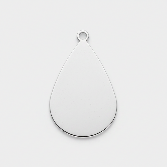 A teardrop-shaped silver metal pendant with a small loop at the top, shown on a plain white background.