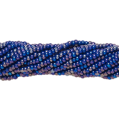 A close-up of a strand of small, round, iridescent blue beads on a plain white background.