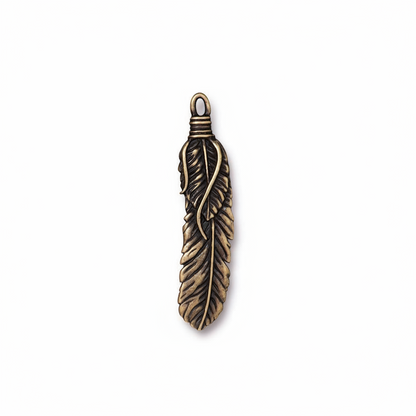 An antique bronze feather pendant charm with a detailed textured feather design and a wrapped loop at the top, shown on a plain white background.