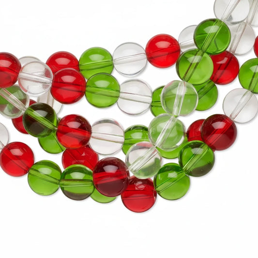 Clear round glass beads with red and green color bands, arranged in a close-up diagonal pattern on a white background.