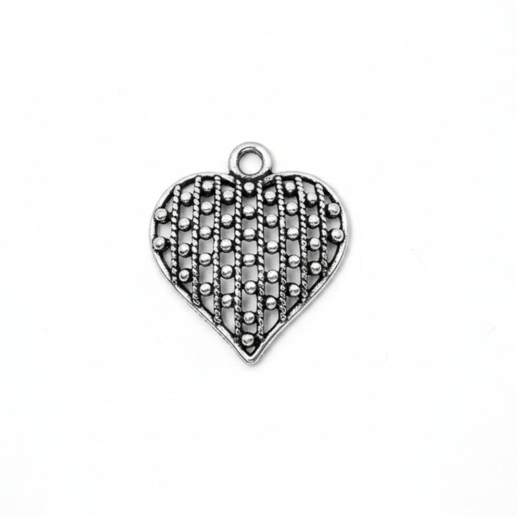 A heart-shaped silver charm with an openwork, textured pattern and a small top loop, shown on a plain white background.