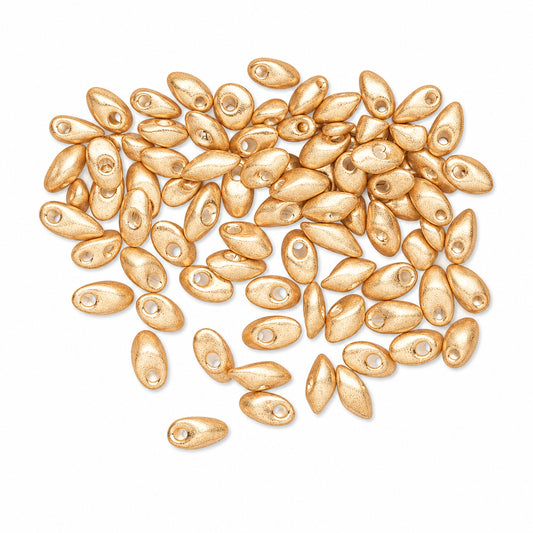 A pile of small metallic rose gold oval beads with pre-drilled holes, scattered on a plain white background.