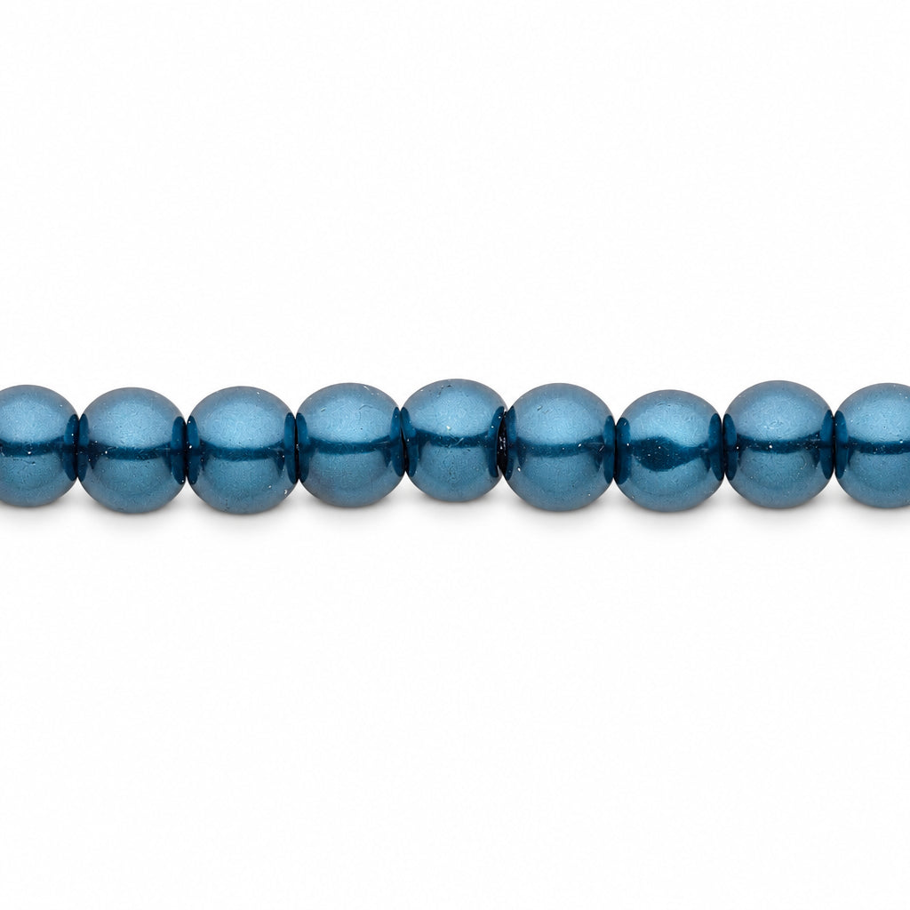A close-up horizontal line of blue round beads on a plain white background.
