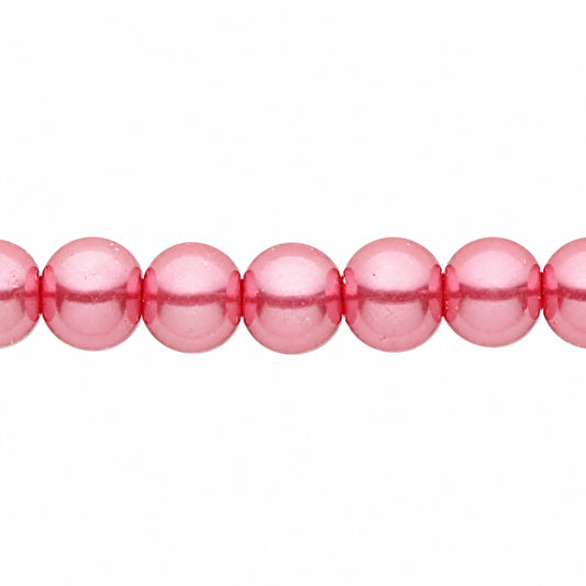 A close-up of glossy, pink round beads strung horizontally against a plain white background.