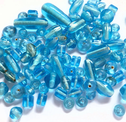 India Pressed Glass Transparent Light Turquoise Blue Bead Mix 50g (60-100 beads)
