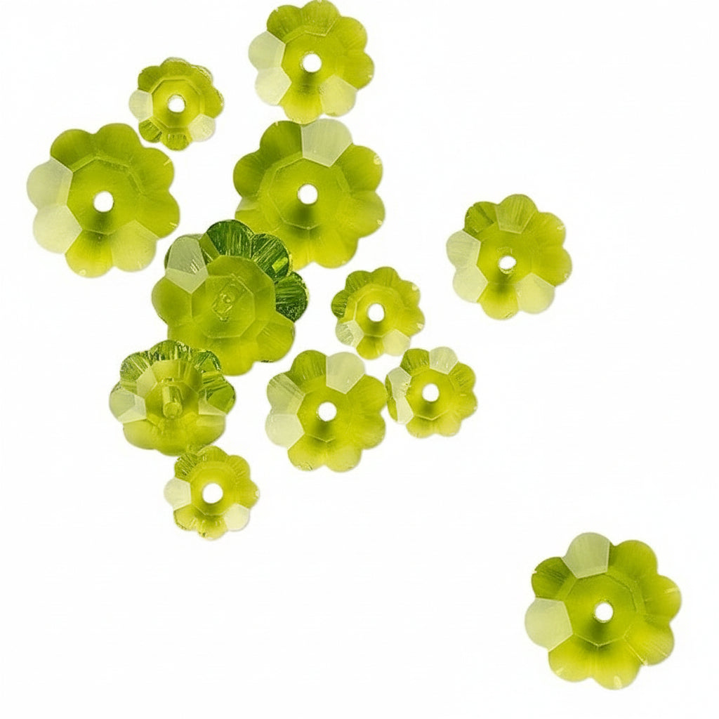 A set of translucent lime green faceted flower-shaped beads with a central hole, scattered on a plain white background.
