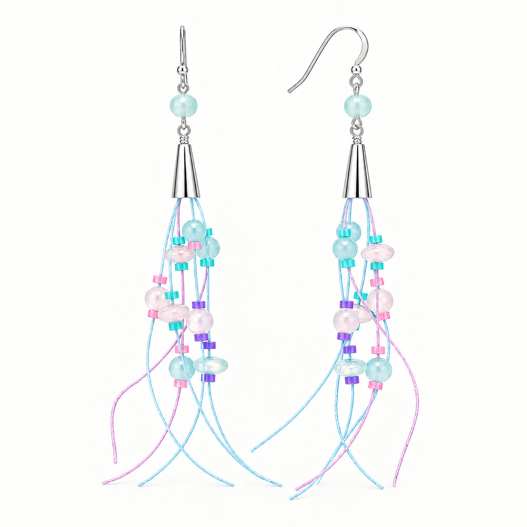 A pair of long dangle earrings with silver-toned metal hooks and cones, decorated with light blue, white, pink, and purple beads, shown against a solid dark gray background.