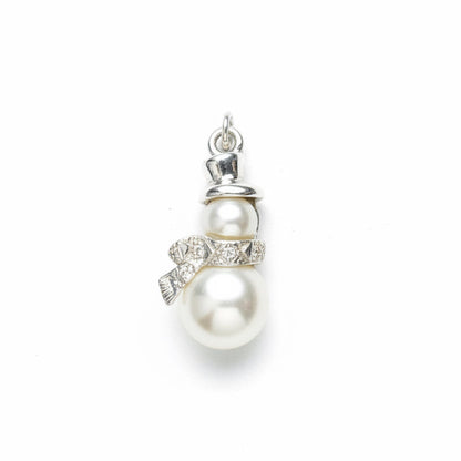 A snowman charm pendant featuring two white faux pearls, a silver top hat, and a silver scarf embellished with clear rhinestones, set against a light gray textured background.