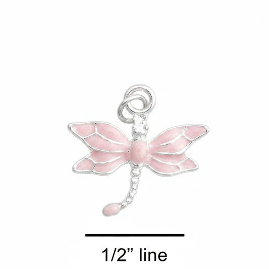 A small dragonfly charm with pink wings and a silver body and loop, shown on a blue textured background with a '1/2" line' size marker below.