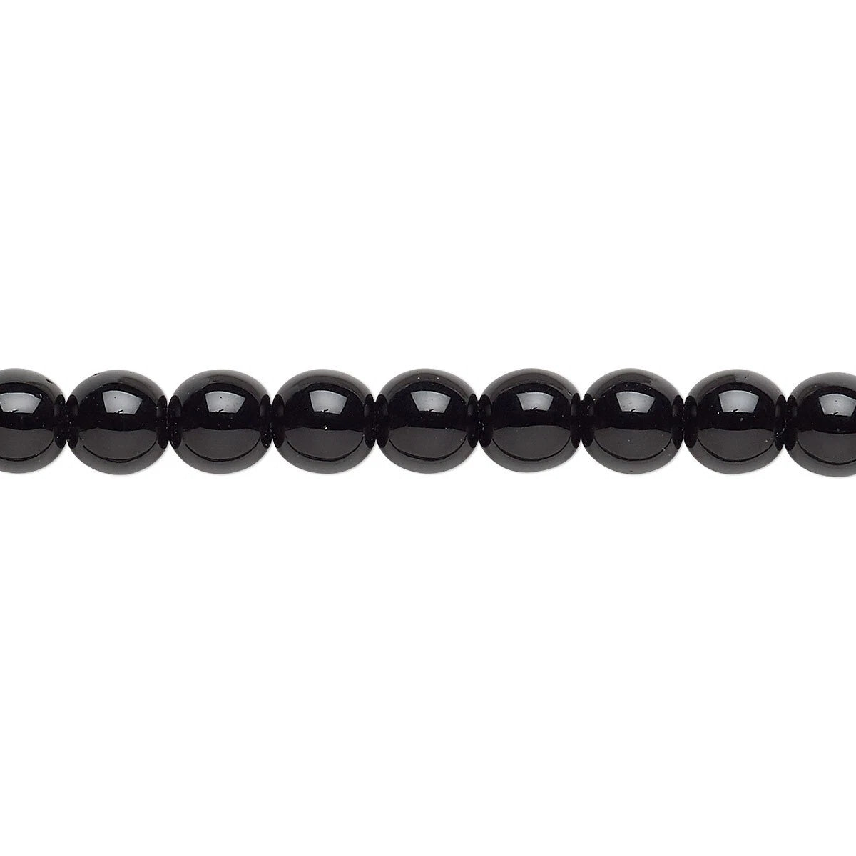 A close-up horizontal line of glossy black round beads on a plain white background.