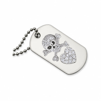 A silver-toned dog tag necklace featuring a skull and crossbones design embellished with clear rhinestones, alongside a heart-shaped crystal cluster, on a white background.