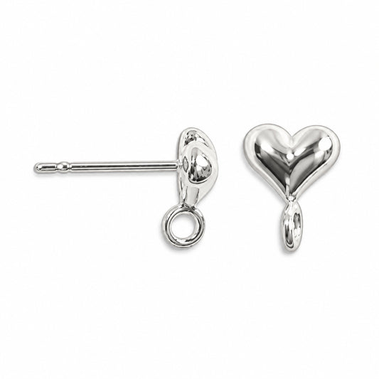 A pair of sterling silver heart stud earrings, showing one earring from the front with its polished heart charm and the other from the side/back showing the post and butterfly backing, on a solid white background.