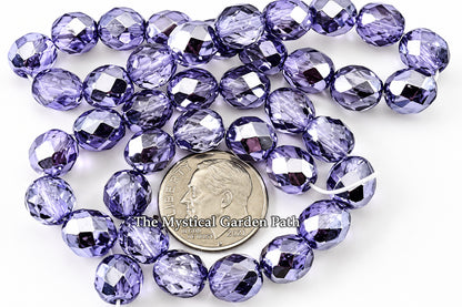 Faceted round beads in a periwinkle or lavender-blue color, arranged around a US quarter coin for scale, on a plain white background with a watermark text overlay.