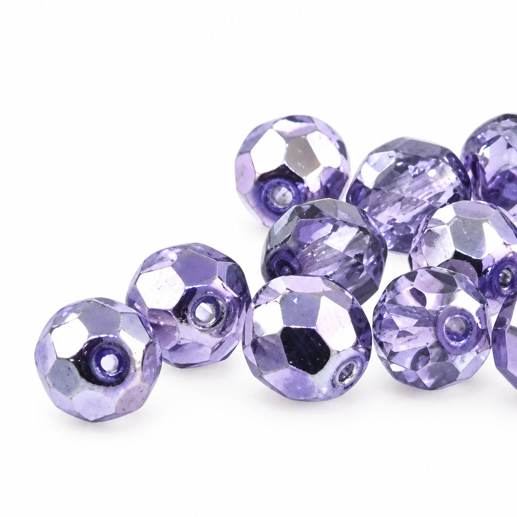 Purple faceted beads on a white background