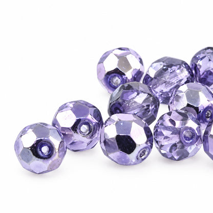 Purple faceted beads on a white background