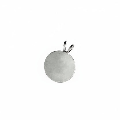 A round silver pendant with a bail at the top, shown on a white background with the text 'The Mystical Garden Path' at the bottom.